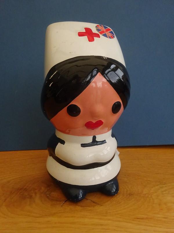 Ceramic Money Box in the shape of a Nursing Sister.